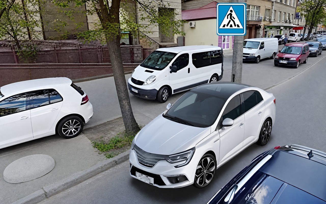 Ілюстрація: Чи дозволено водієві сірого автомобіля зупинитись у цьому місці?